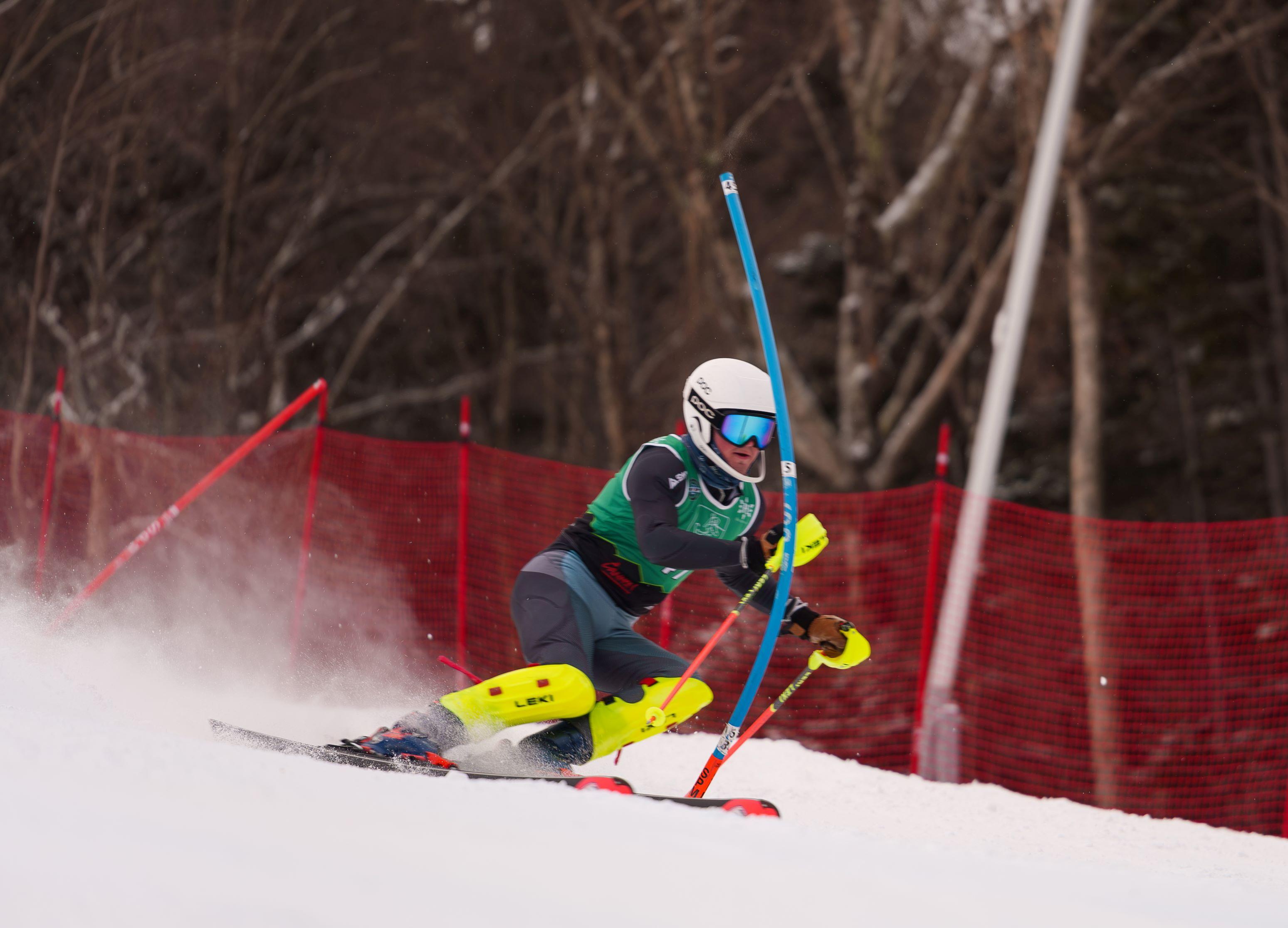 SL skier hits a blue gate