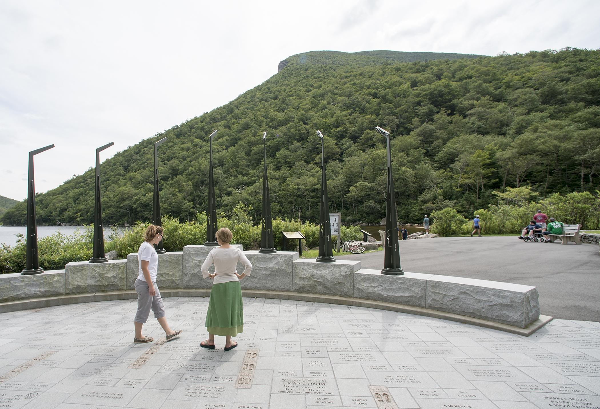 2 guests walk around the old man memorial with the profilers in the background