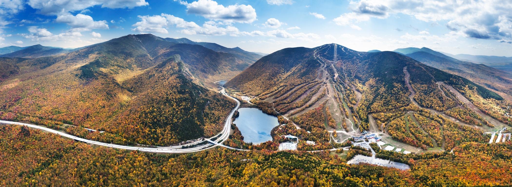 Wide frame areal shot of Franconia Notch in the fall