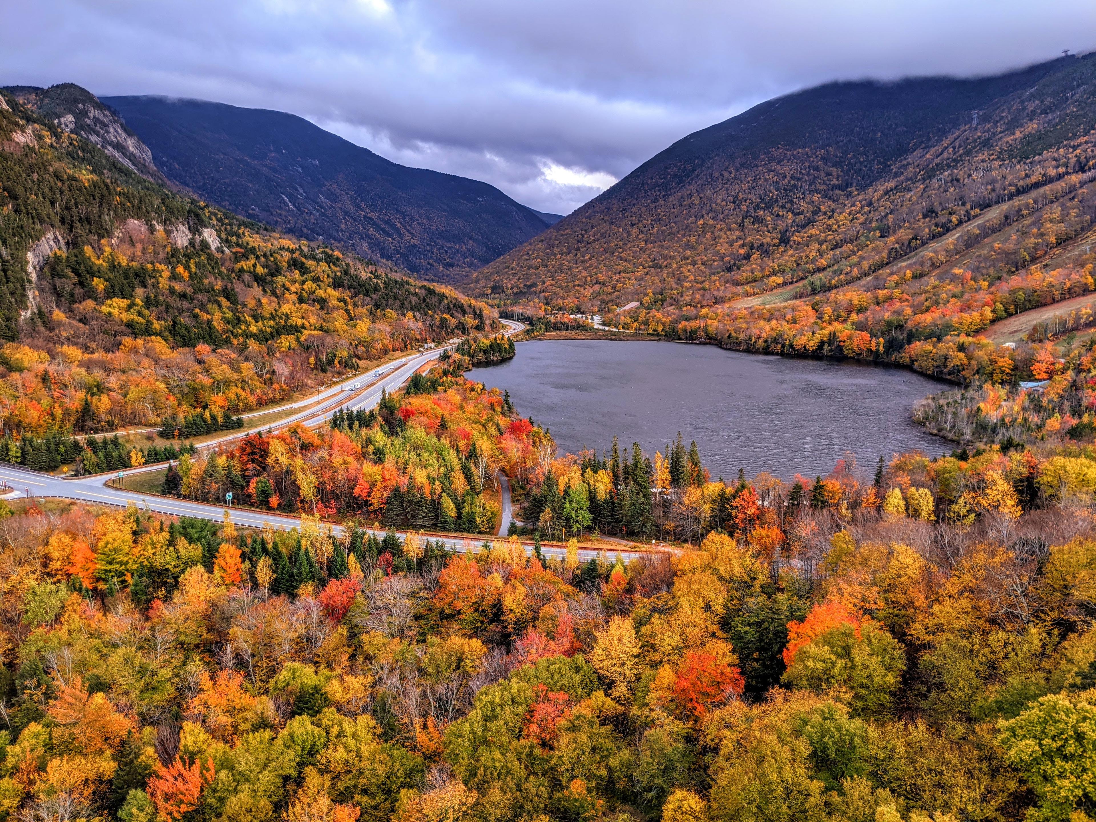 View from Artists Bluff with Echo Lake just past peak foliage on a cloudy day.